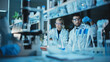 © Gorodenkoff - Female and Male Medical Research Scientists Have a Conversation While Conducting Experiments in Test Tubes with Liquid Samples with and in Beakers with Solid Speciments. Modern Science Laboratory.