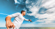 © Maridav - Fishing man casting line recreational activity during summer. Fisherman outdoor on blue sky banner crop background. Sport fishing fish.