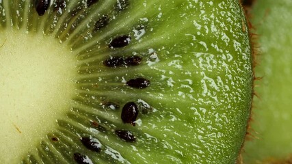 Wall Mural - Sclied Kiwi rotating. Ripe Tropical fruits macro shot