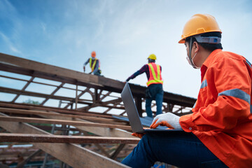 Engineer technician construction worker control roofer working on roof structure of building in construction site, Roof metal sheet construction concept.