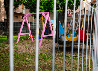 Closed playground, fences, closed Covid-19, Coronavirus, abandoned playground