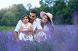 © serhiibobyk - Couple with daughter posing in lavender field