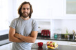 © wavebreak3 - Portrait of caucasian man in kitchen smiling with arms crossed