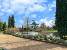 Scenic View Of A Beautiful English Style Hyde Hall Garden With Green Lawn And Blue Sky, RHS Garden, UK, 17 March 2020