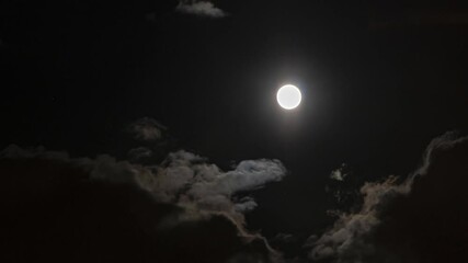 time lapse video of the moon coming through the clouds