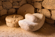 Ancient Grain Grinding Millstones (to Make Flour) On A Rustic House
