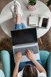 © perfectlab - Young woman using laptop to work home, remote work