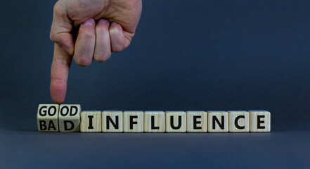 good or bad influence symbol. businessman turns cubes and changes words 'bad influence' to 'good inf