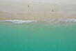 © Adrian Young/Austockphoto - Aerial view of a Perth beach in summer, with the long shadows of people walking in the early morning