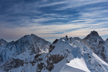 Wall Mural - Beautiful winter views of the High Tatra Mountains with tourists, skiers and amazing states of nature