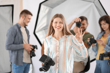 Poster - Portrait of female photographer in studio