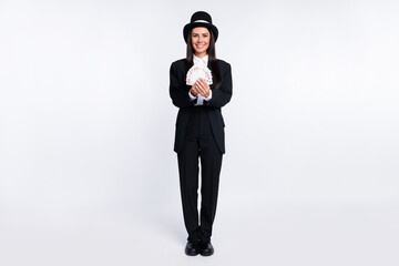 Sticker - Full size photo of happy smiling good mood woman magician showing you card trick isolated on white color background