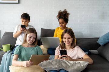 Wall Mural - Multiethnic diverse teens studying at home for online school