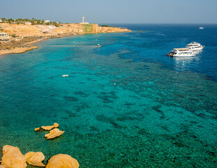 sunny panorama of ras um el sid bay in sharm el sheikh with sea, reef and beaches