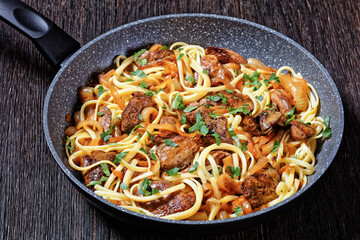 Wall Mural - pasta linguine with fried chicken liver, top view