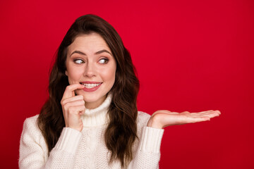 Sticker - Photo of nice optimistic brunette lady look empty space wear white sweater isolated on vivid red color background