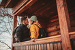 © Minet - Loving man and woman standing in their cottage room balcony