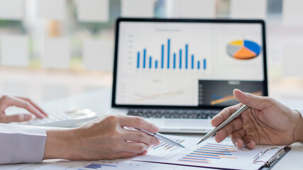 Business group team meeting on presentation of graph analysis for work planning, investment projects and strategy, financial and accounting concepts.