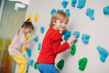 Kid Child Boy At Climbing Wall. Children Sport, Healthy Lifestyle In Kindergarten Or Sport Center In School
