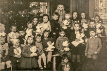 Germany - CIRCA 1940s: Group Photo Of Small Kids Girls Boys And Santa Claus On Christmas New Year Eve Party. Vintage Archive Art Deco Era Photography
