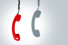 Red Telephone Handset With A Dark Shadow. Concepts Of Hotline, Support Or Phone Scams.