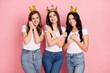 © deagreez - Photo of three young adorable girls happy smile appreciate glad golden crown royalty princess isolated over pink color background
