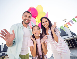 Sticker - Photo of beautiful family cheerful guy attractive lady little girl raise hands look camera have fun outdoors