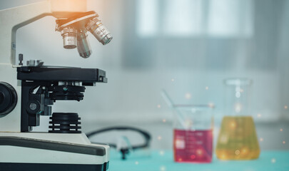 Microscope in medical laboratory. Clinician studying chemical element in working environment or Testing for Coronavirus Covid19 vaccine