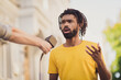 © deagreez - Photo portrait of young man giving interview on street speaking on camera for press television