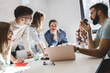© BalanceFormCreative - Group of programmers an designers in conference room.They discussing about development of new project.
