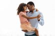 © Prostock-studio - Cute black father and daughter dancing over white