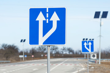 Additional lane warning road sign. Regulation of traffic on a high-speed road.