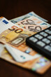 50 Euro bills with a calculator