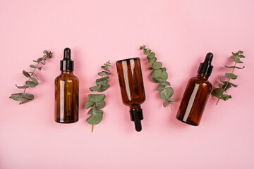 Poster - Flat lay with Natural organic cosmetics: serum, cream on pink background with green leaves. Skincare, cosmetology, dermatology concept. Beauty certificate, blog style. Top view, mockup, overhead