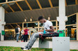 © Maskot - Male college student e-learning on laptop in campus