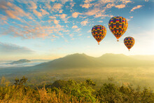 Colorful Hot-air Balloons Flying Over The Mountain,Doi Inthanon National Park In The Sunrise And Main Road At Chiang Mai Province, Thailand