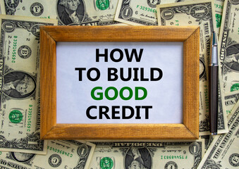 Wall Mural - How to build good credit symbol. Wooden frame with words 'how to build good credit'. Beautiful background from dollar bills. Business and build good credit concept.