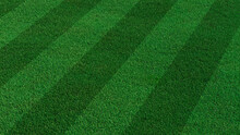 Green Grass Texture Background. A Perfectly Manicured Sports Field / Pitch / Garden Lawn Wallpaper With Stripes.