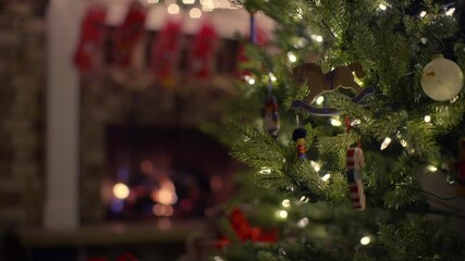 close up, hanging christmas decorations on tree