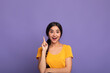 © Prostock-studio - Excited indian woman has great idea and points up