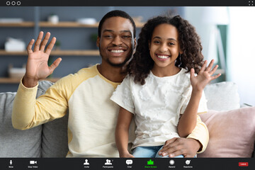 Wall Mural - Happy african american family kid and dad having video call