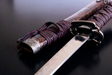 Samurai Sword And Scabbard On Wooden Background