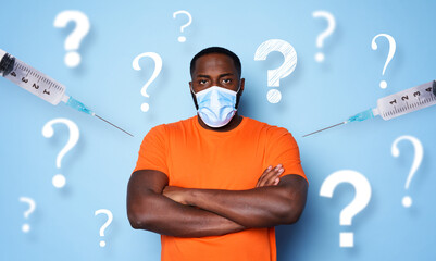 Wall Mural - Man with face mask has a lot of questions and doubts about covid 19 vaccine. cyan background
