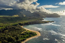 Rugged Mountain Ridges, Sandy Beaches And Big Ocean Under Dramatic Clouds, Mahaulepu Beach And Haupu Mountain, Kauai..