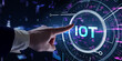© putilov_denis - Internet of things - IOT concept. Businessman offer IOT products and solutions. Young businessman  select the abstract chip with text IoT on the virtual display.