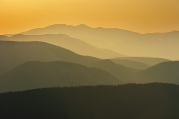 Wall Mural - Beautiful sunrise in the Carpathian mountains with fog and dramatic sky	