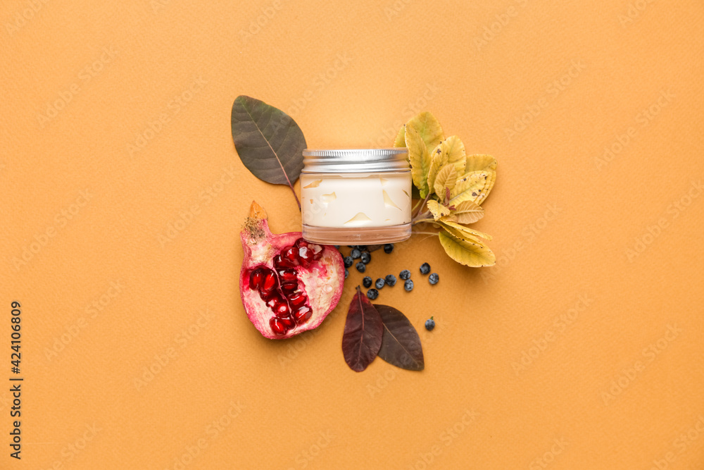 Composition with jar of natural cream on color background