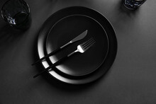 Plates And Cutlery On Dark Background