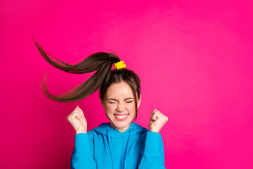 Sticker - Photo of impressed young girl closed eyes toothy smile fists up won lottery isolated on pink color background