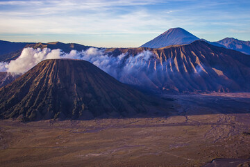 Wall Mural - Beautiful caldera with erupting and active Bromo volcano, mount Batok and volcano Semeru on the backgrounbd. Bromo Tengger Semeru National Park, East Java, Indonesia.